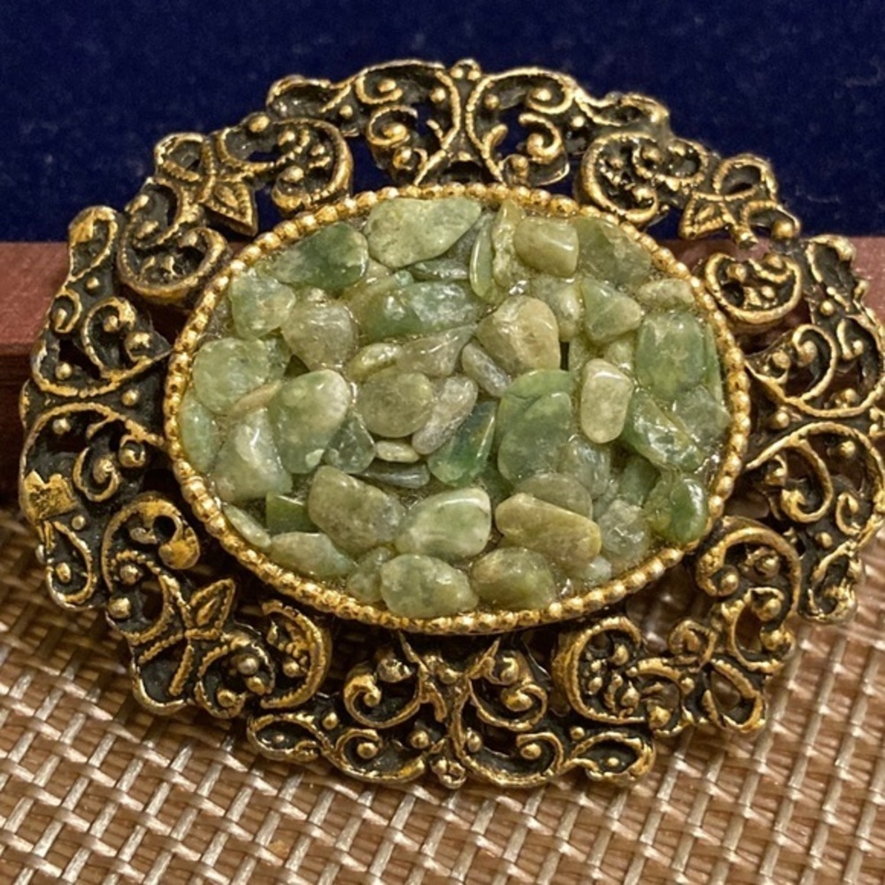 Ornate framed green mosaic pin
